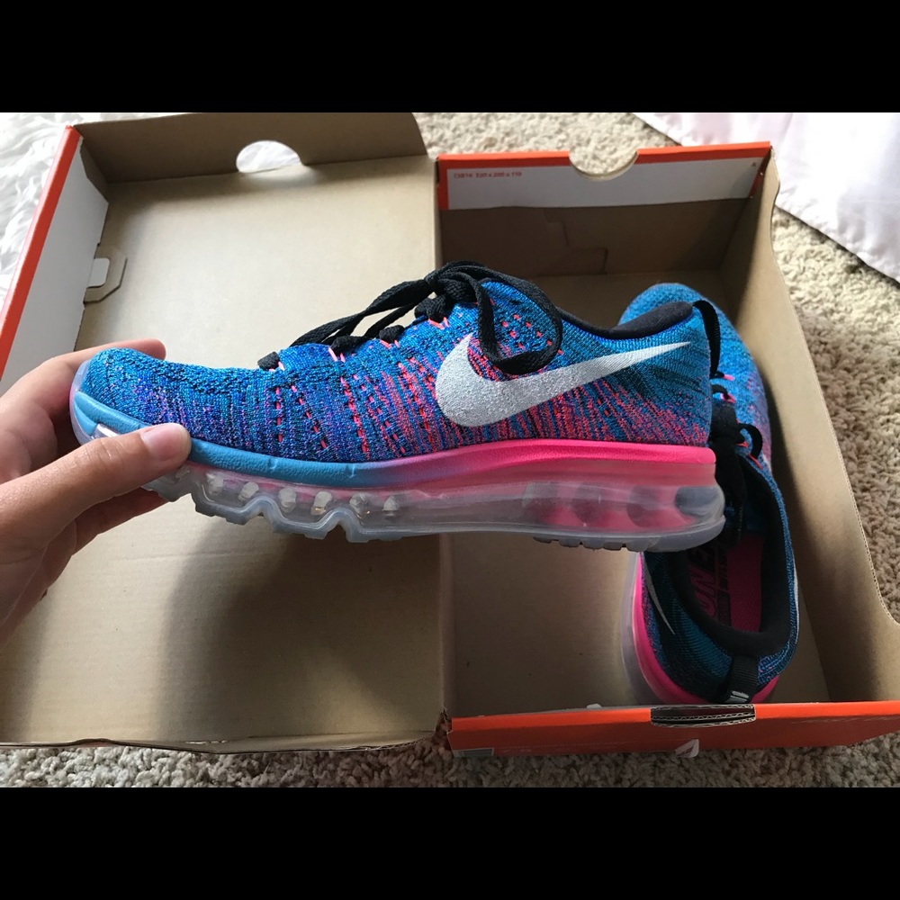 Woman’s Nike Flyknit Max tennis shoes